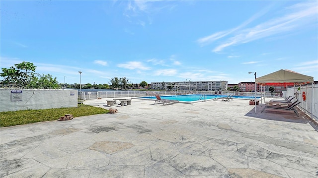 view of swimming pool featuring a patio