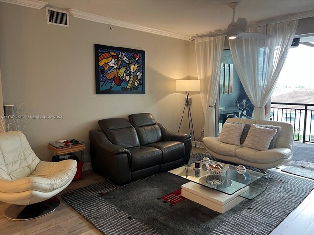 1660 Renaissance Commons Blvd Unit 2518, Boynton Beach, FL 33426 - living area with wood finished floors, ornamental molding, and a ceiling fan