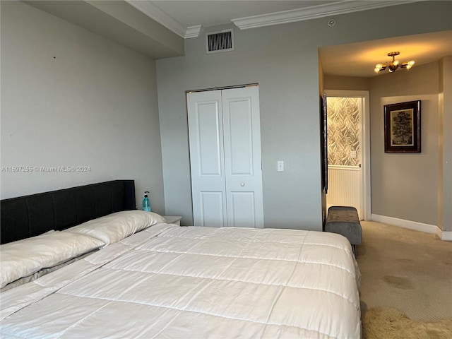 bedroom with an inviting chandelier, ornamental molding, light carpet, and a closet