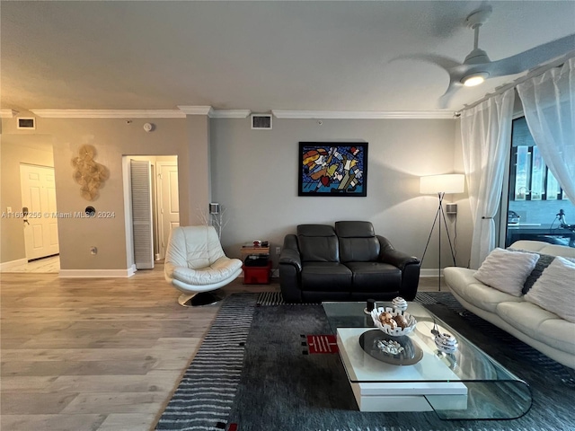 living room with ceiling fan, hardwood / wood-style floors, and ornamental molding