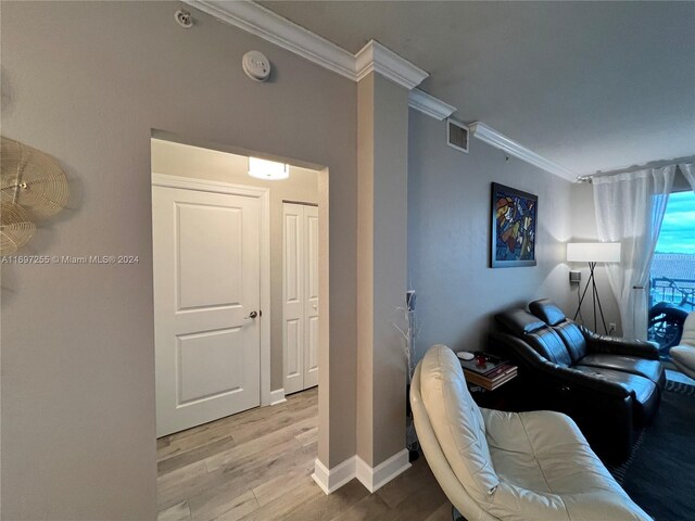 1660 Renaissance Commons Blvd Unit 2518, Boynton Beach, FL 33426 - living area featuring ornamental molding and wood finished floors