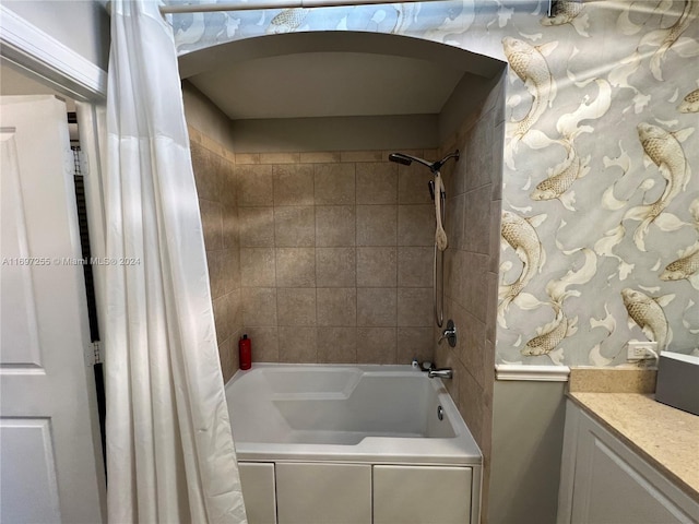 bathroom featuring vanity and shower / tub combo