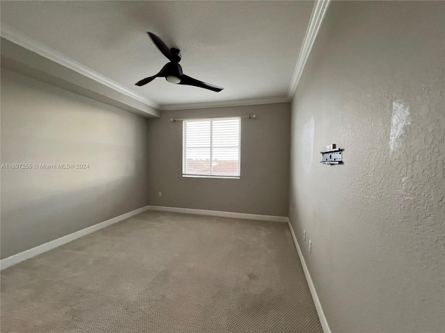 unfurnished room featuring carpet floors, ceiling fan, and crown molding