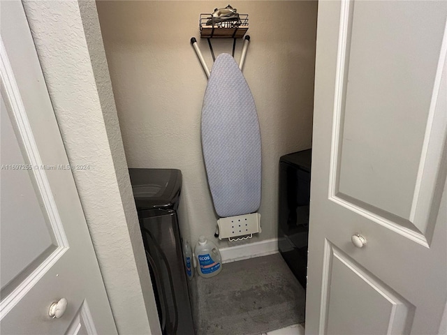 clothes washing area featuring washing machine and dryer