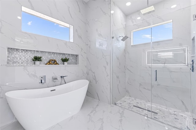 bathroom with independent shower and bath and tile walls