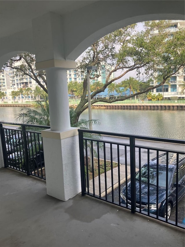 balcony featuring a water view