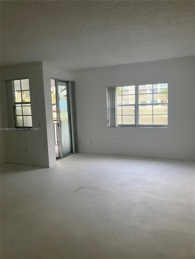 empty room featuring a textured ceiling