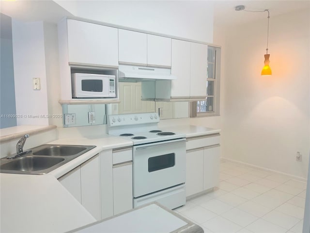 kitchen featuring sink, pendant lighting, white cabinets, and white appliances