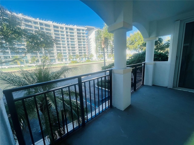 balcony featuring a water view