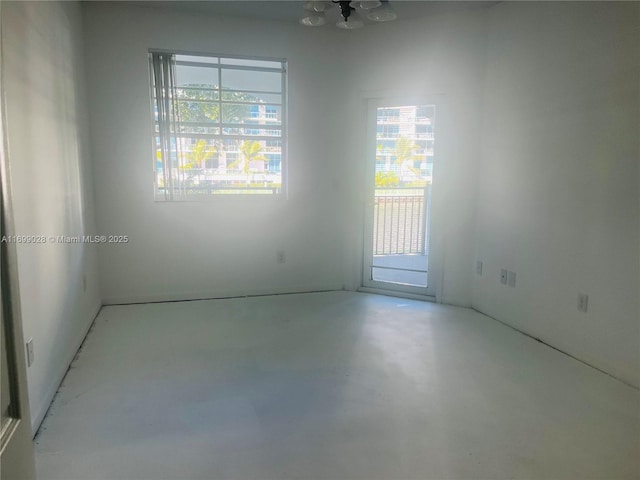 spare room with concrete floors