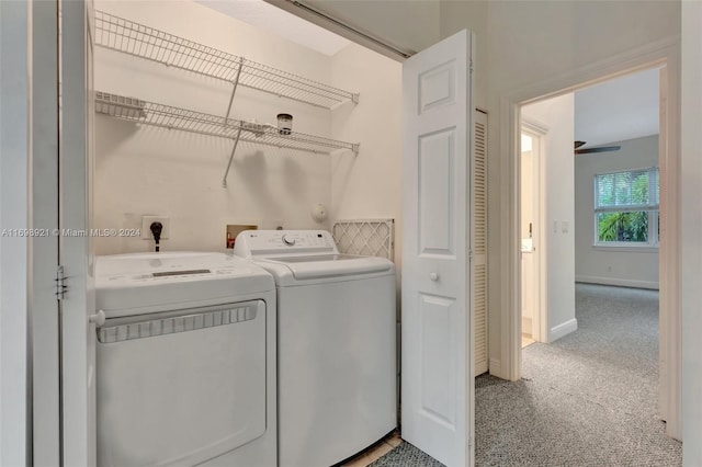 laundry area with washing machine and dryer and carpet floors