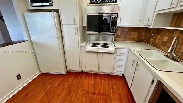 kitchen featuring white cabinets, white appliances, and sink