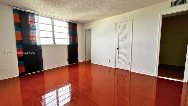 unfurnished bedroom featuring a textured ceiling