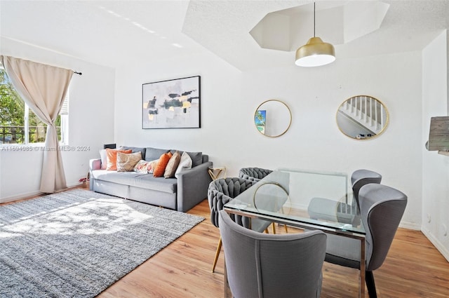 living room featuring a textured ceiling and hardwood / wood-style flooring