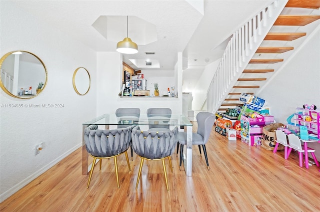 dining area featuring hardwood / wood-style flooring