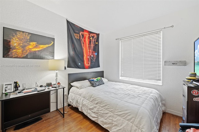 bedroom featuring hardwood / wood-style floors