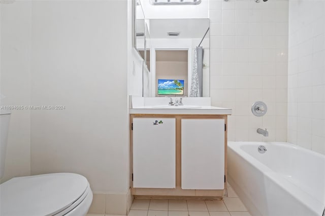 full bathroom with tile patterned flooring, shower / bath combo, vanity, and toilet