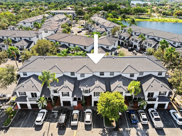 birds eye view of property featuring a water view