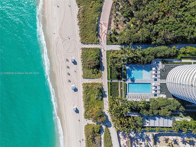 drone / aerial view with a water view and a view of the beach