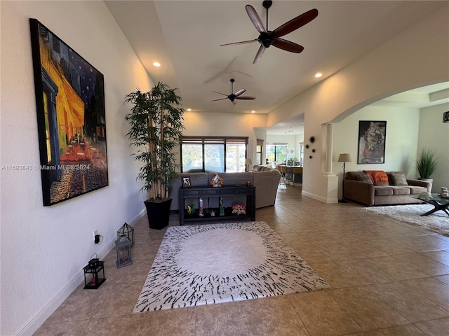 living room with tile patterned floors and ceiling fan