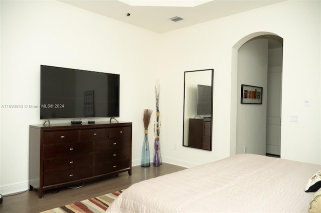 bedroom featuring dark hardwood / wood-style flooring