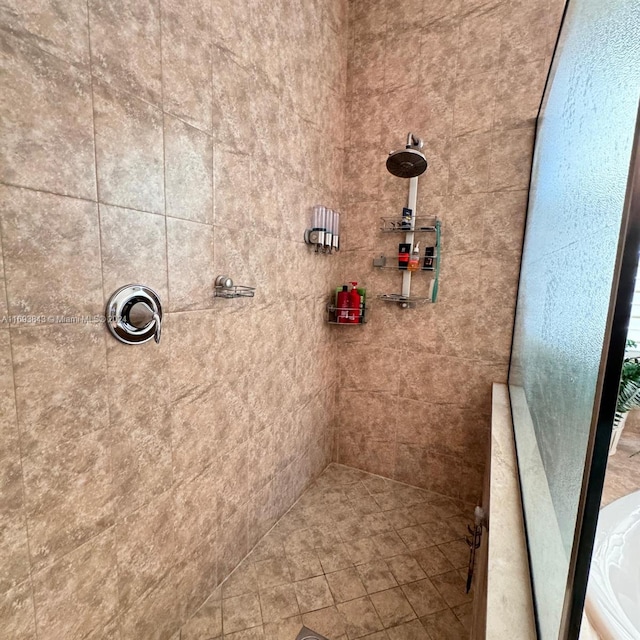 bathroom with tiled shower