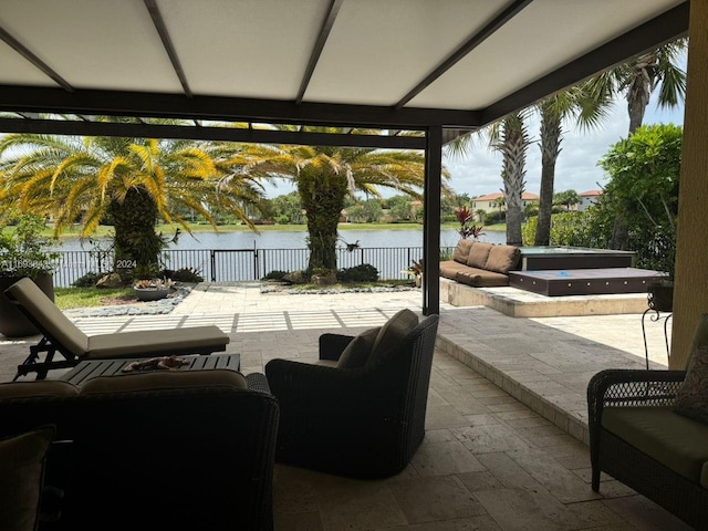 view of patio featuring an outdoor living space and a water view