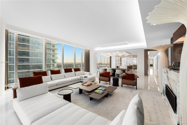 tiled living room featuring a premium fireplace