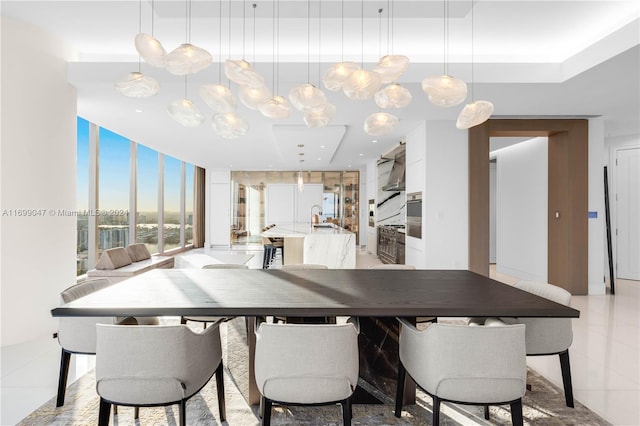 tiled dining space featuring expansive windows