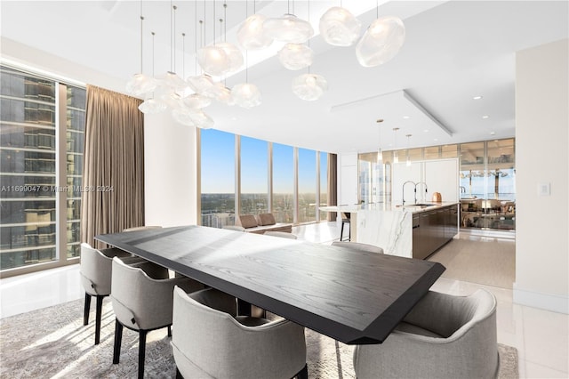 tiled dining area featuring expansive windows and sink