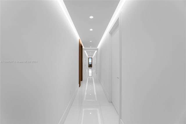 hall featuring light tile patterned flooring