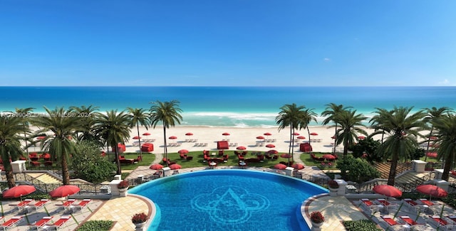 view of swimming pool featuring a beach view and a water view