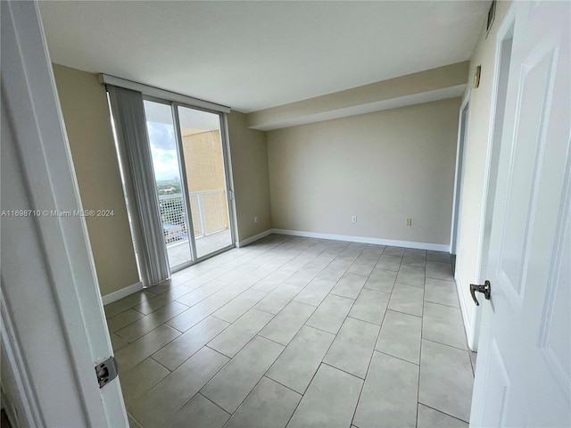 unfurnished room featuring light tile patterned flooring