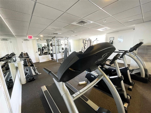 gym featuring a paneled ceiling