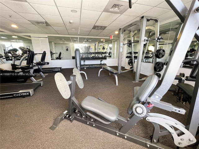 exercise room featuring a paneled ceiling