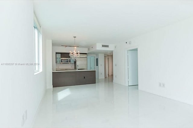 500 Brickell Ave Unit 2910, Miami, FL 33131 - unfurnished room with a notable chandelier