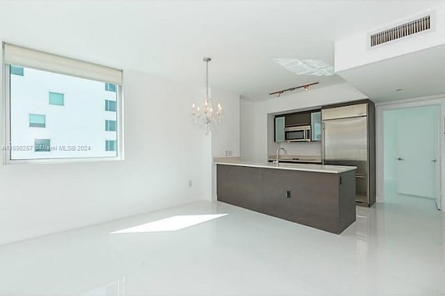 500 Brickell Ave Unit 2910, Miami, FL 33131 - kitchen featuring kitchen peninsula, a chandelier, pendant lighting, and appliances with stainless steel finishes