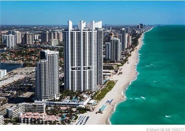 bird's eye view with a beach view and a water view