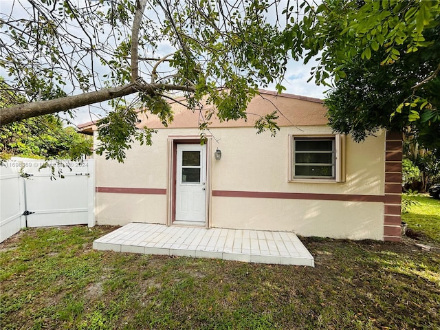 rear view of house with a yard