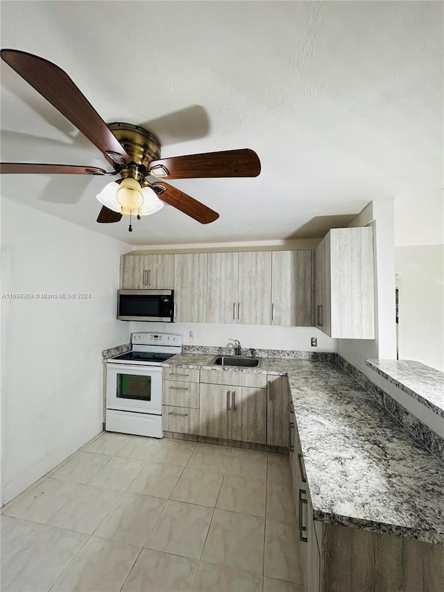 kitchen with stone counters, sink, white electric stove, ceiling fan, and light tile patterned floors