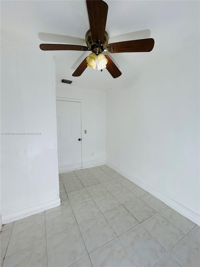 spare room with ceiling fan