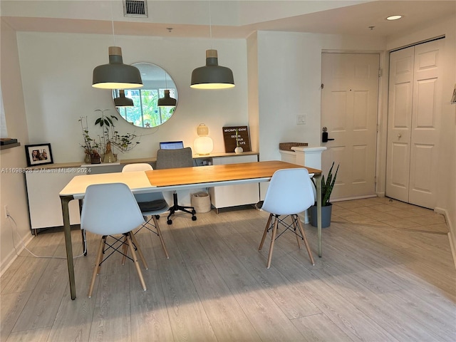 office space with light wood-type flooring