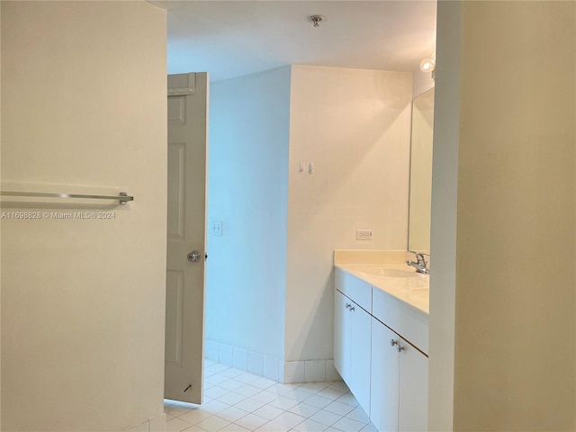 bathroom featuring tile patterned flooring and vanity