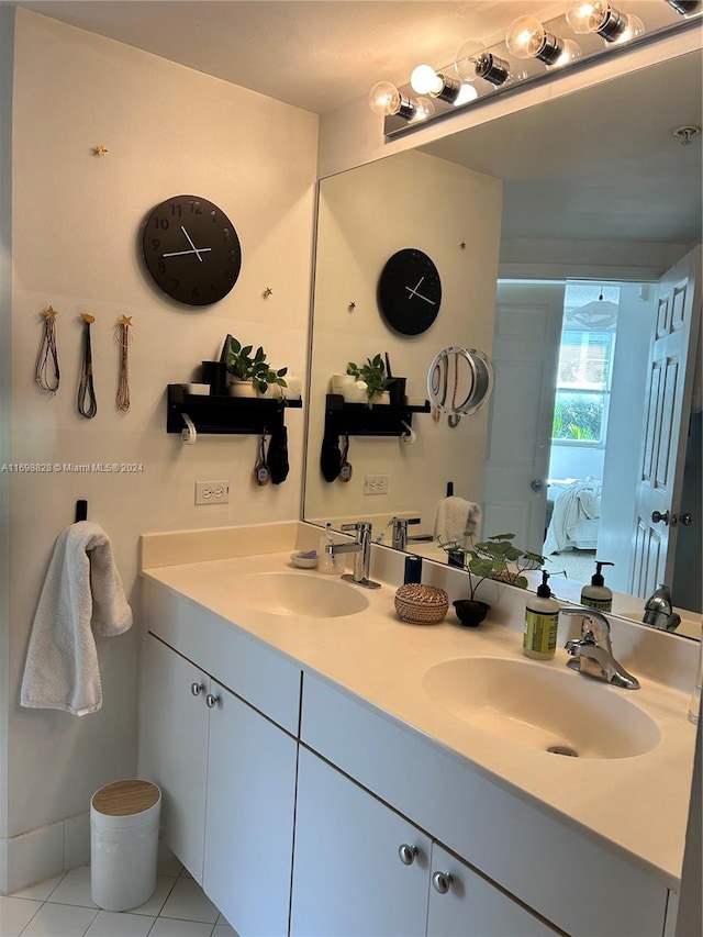 bathroom featuring tile patterned flooring and vanity