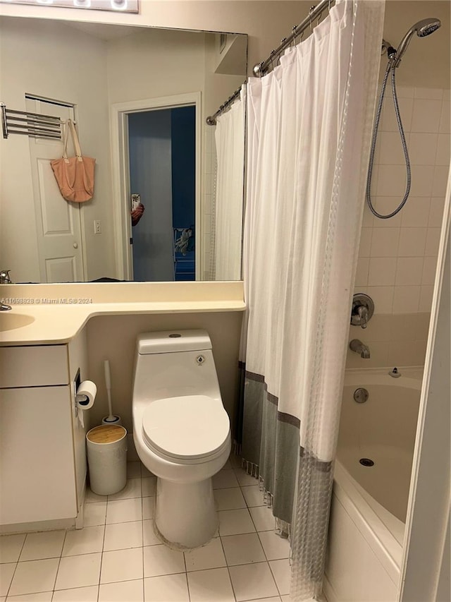 full bathroom with tile patterned floors, shower / bath combination with curtain, toilet, and vanity