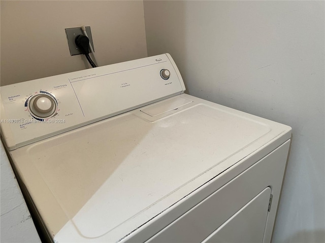 clothes washing area featuring washer / clothes dryer