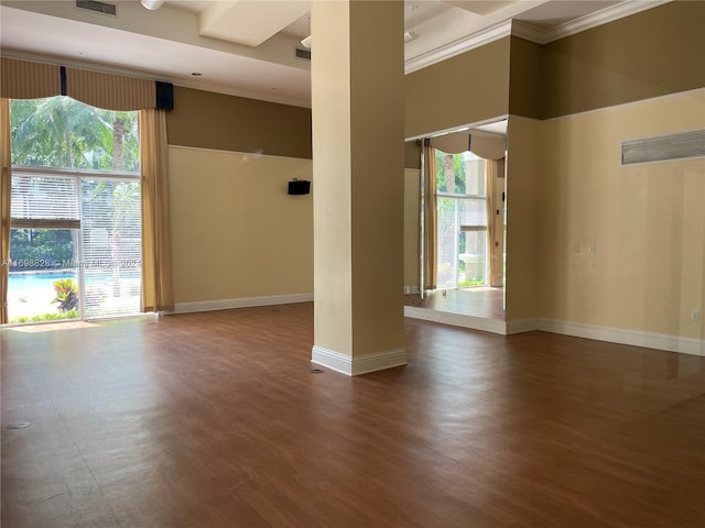 unfurnished room featuring crown molding and dark wood-type flooring