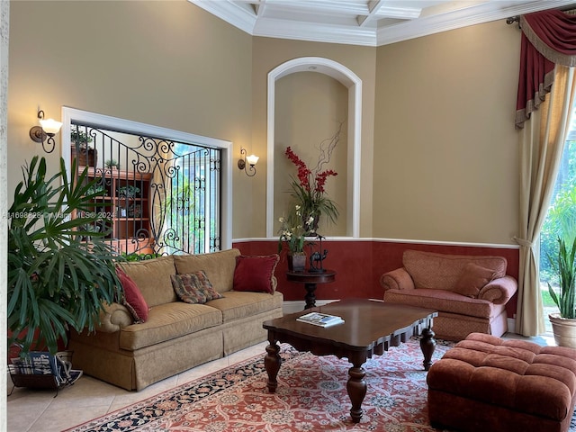 living room with light tile patterned floors, crown molding, and coffered ceiling