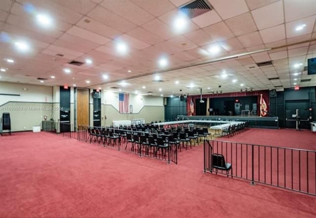 miscellaneous room with carpet floors and a drop ceiling