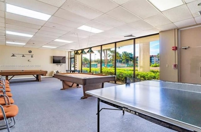 recreation room with a drop ceiling, expansive windows, carpet floors, and pool table